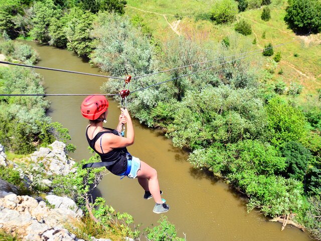 Lady crossing zipline 